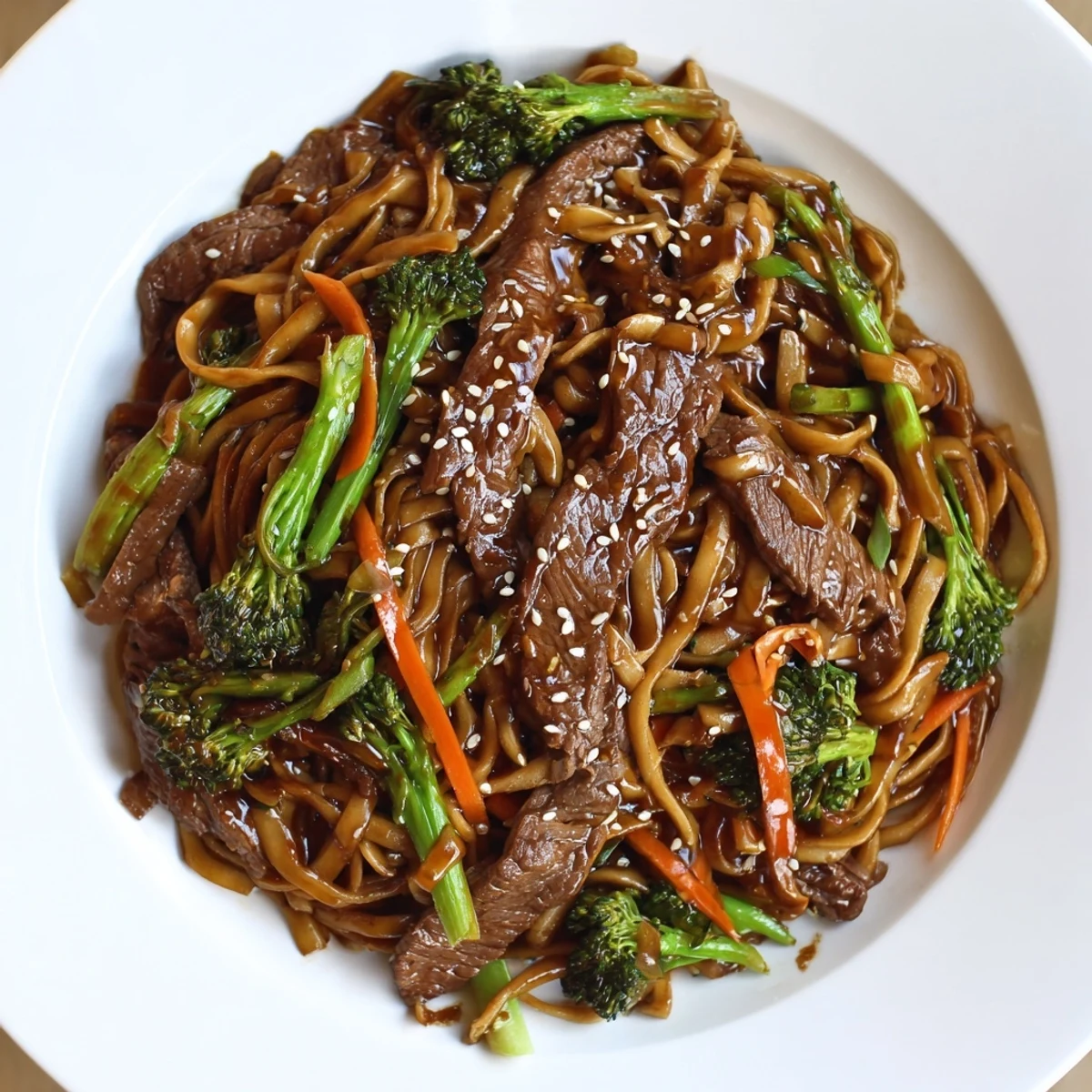 Steaming Beef and Broccoli Noodles, a vibrant stir-fry with glistening beef and tender noodles.