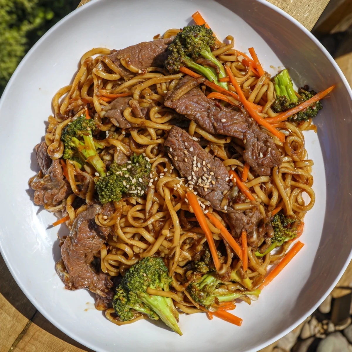 A close-up of Beef and Broccoli Noodles, showcasing the flavorful sauce coating each ingredient well.