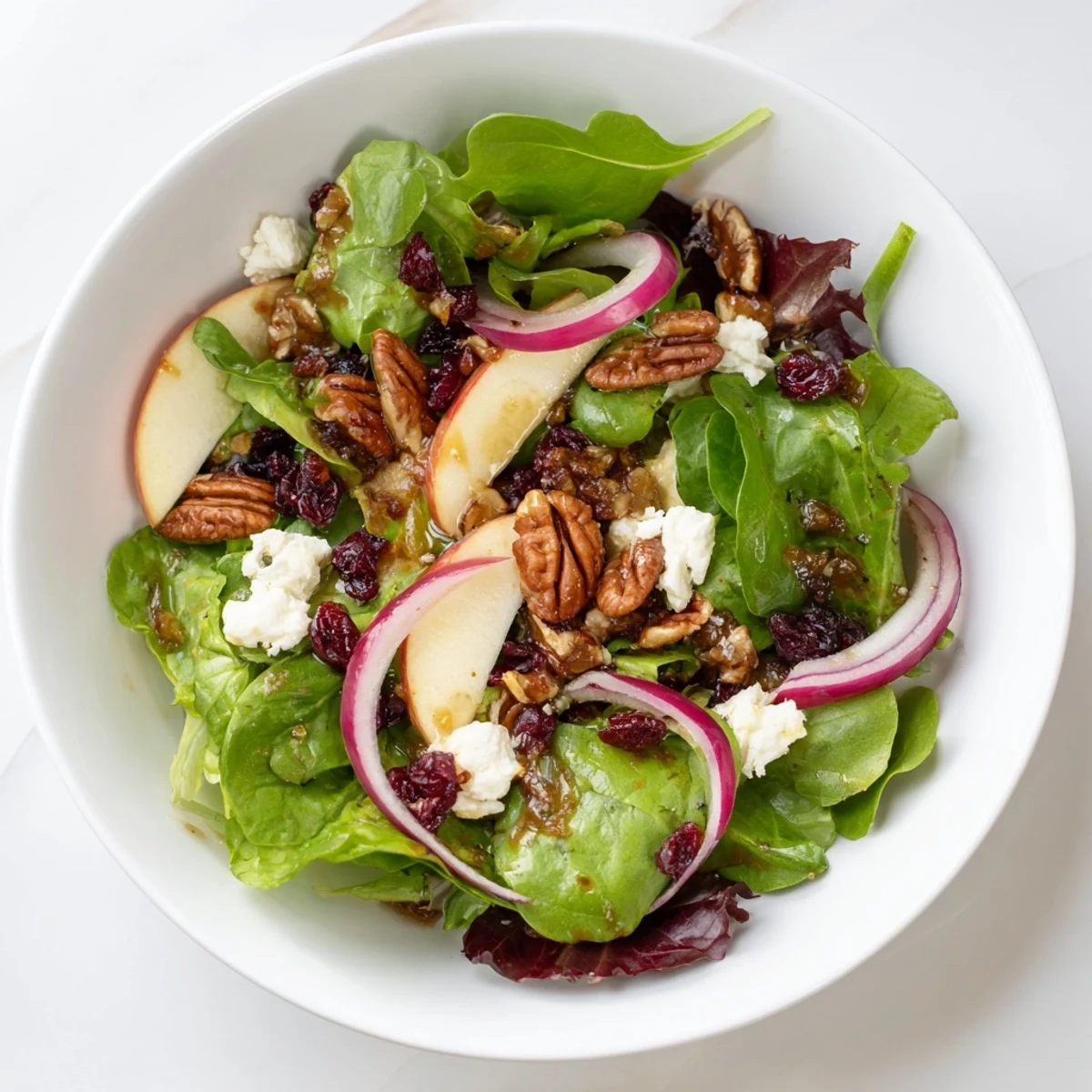 This beautiful bowl of Cranberry Pecan Salad boasts festive cranberries tossed in zesty dressing.