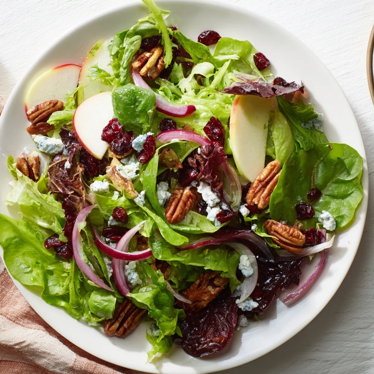 Enjoy a close-up of this delicious Cranberry Pecan Salad, ready for a light lunch or dinner side.