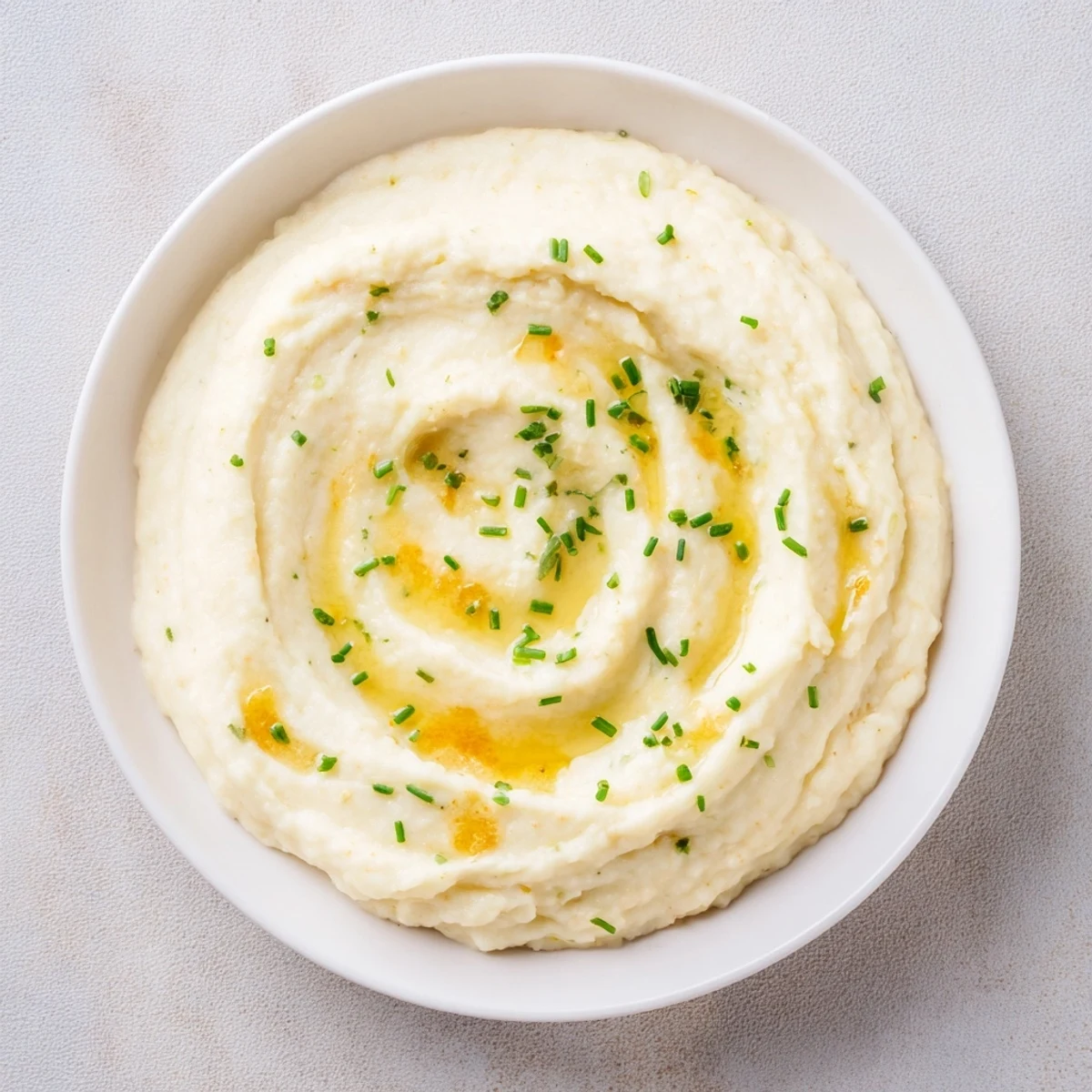 This velvety, light Roasted Garlic Mashed Cauliflower is a perfect comforting, low-carb dish.