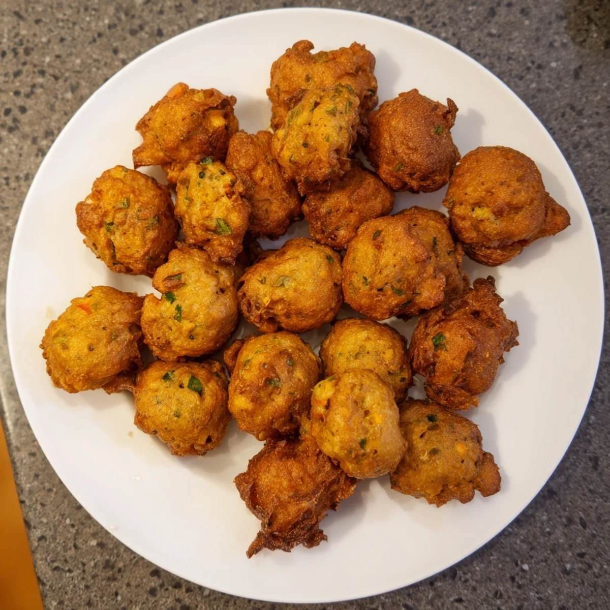 A beautiful close-up of the Bite Crispy fritters showcases their lovely texture and delicious, savory flavor.