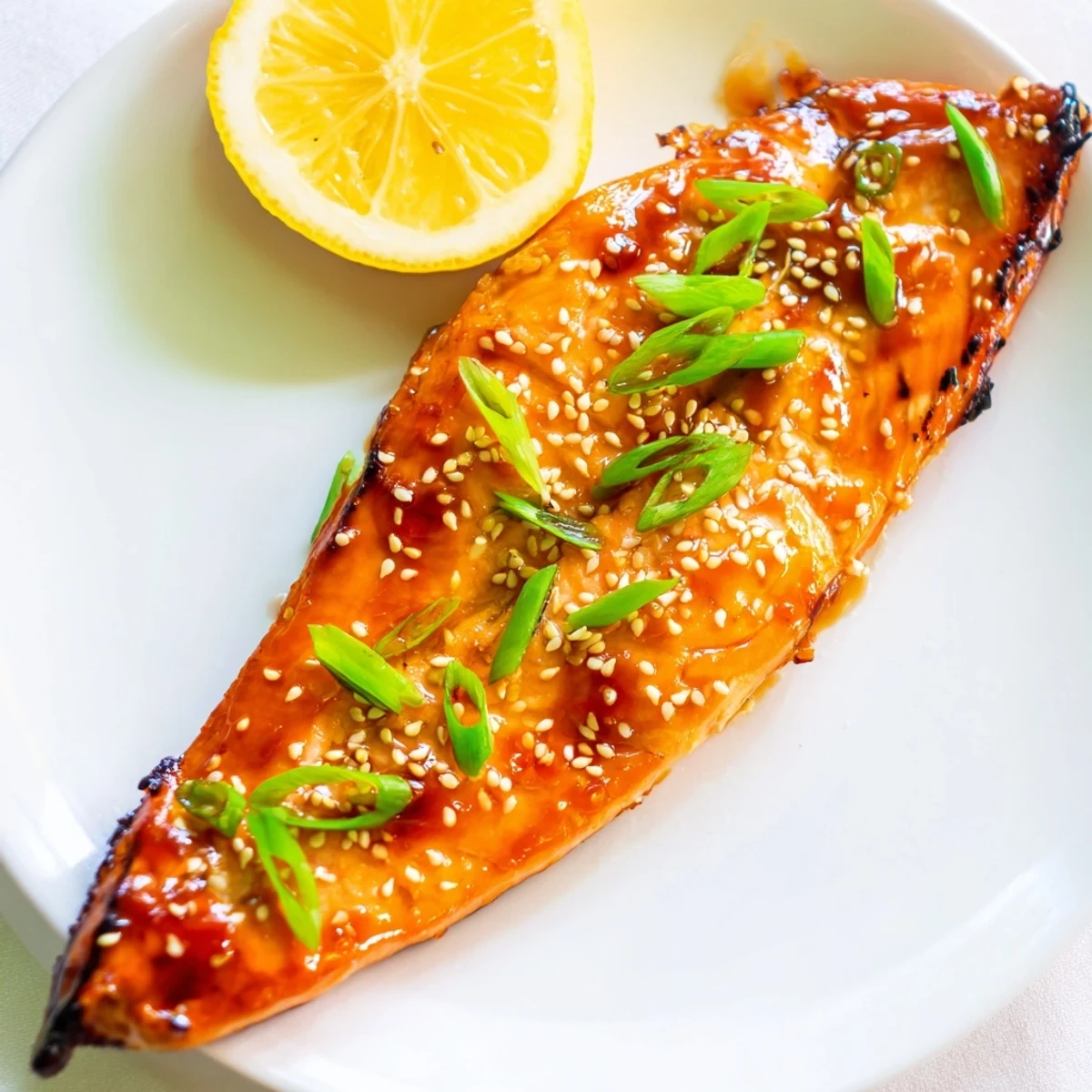 Oven-baked salmon with teriyaki glaze, glistening and ready for a flavorful, easy dinner.