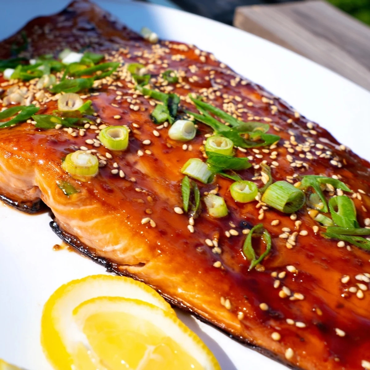 Flaky, glazed baked salmon with teriyaki sauce offers a delicious weeknight meal, served hot.