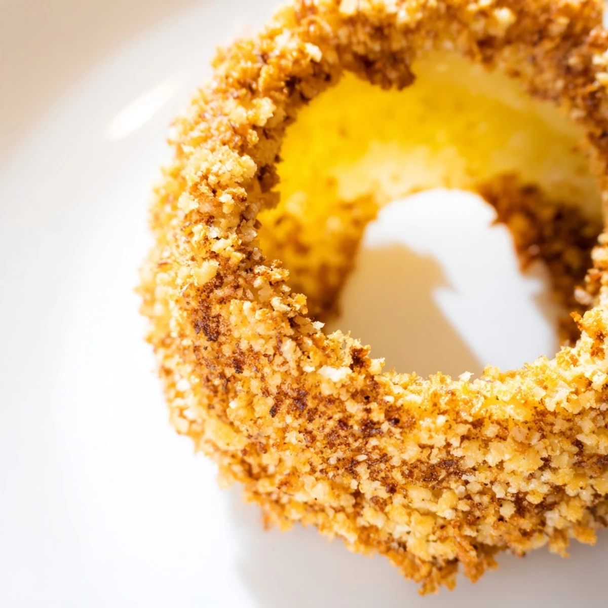 Perfectly seasoned Crispy Baked Onion Rings served hot with a side of creamy ranch dip.