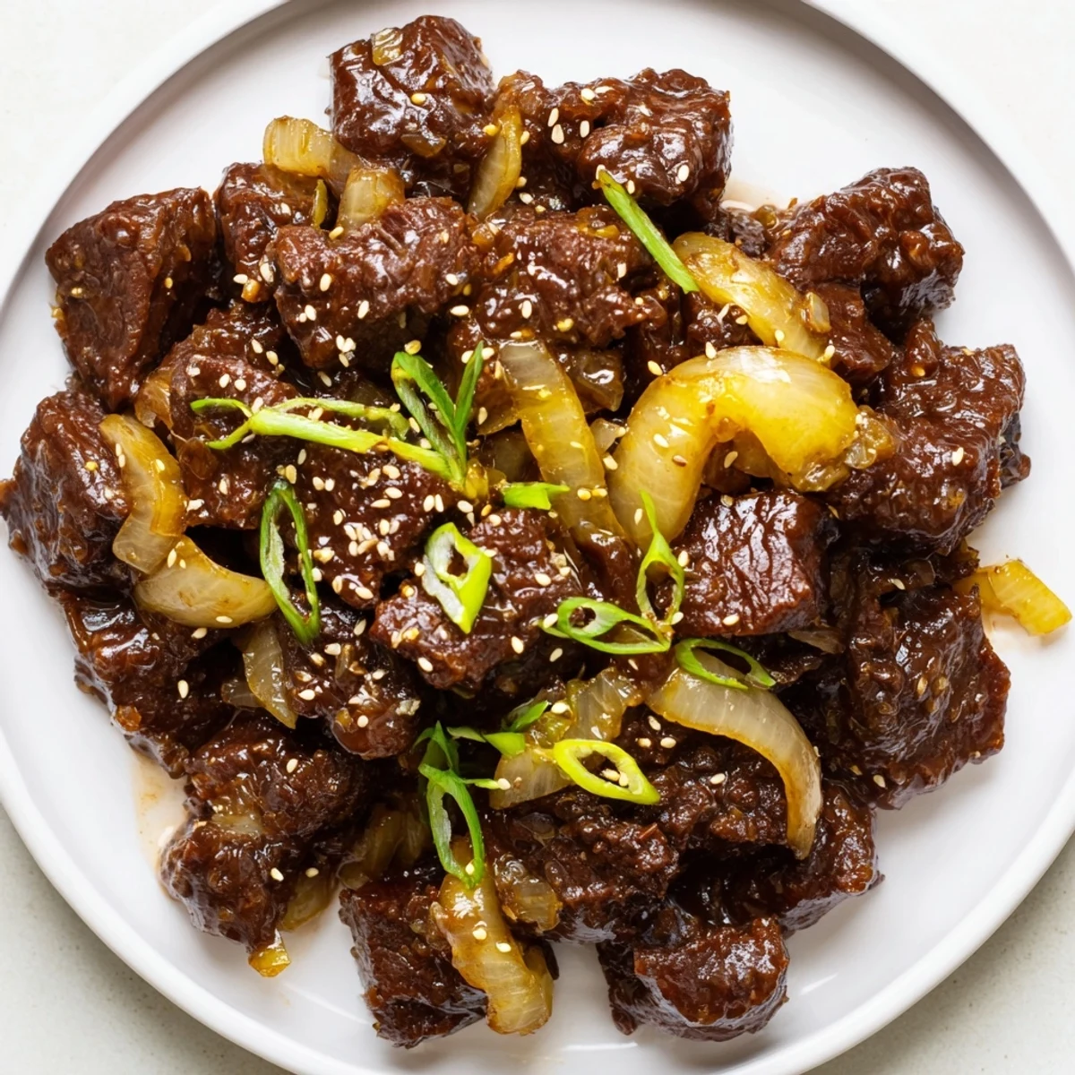 Fork-tender Crock Pot Korean Beef simmering in a glossy, spicy-sweet sauce served over steamed jasmine rice.