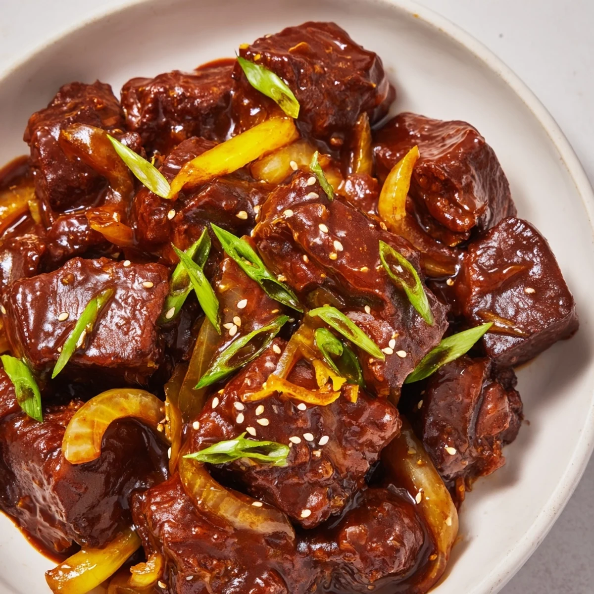 Hearty Crock Pot Korean Beef piled high in a bowl, perfect for easy meal prep with kimchi on the side.