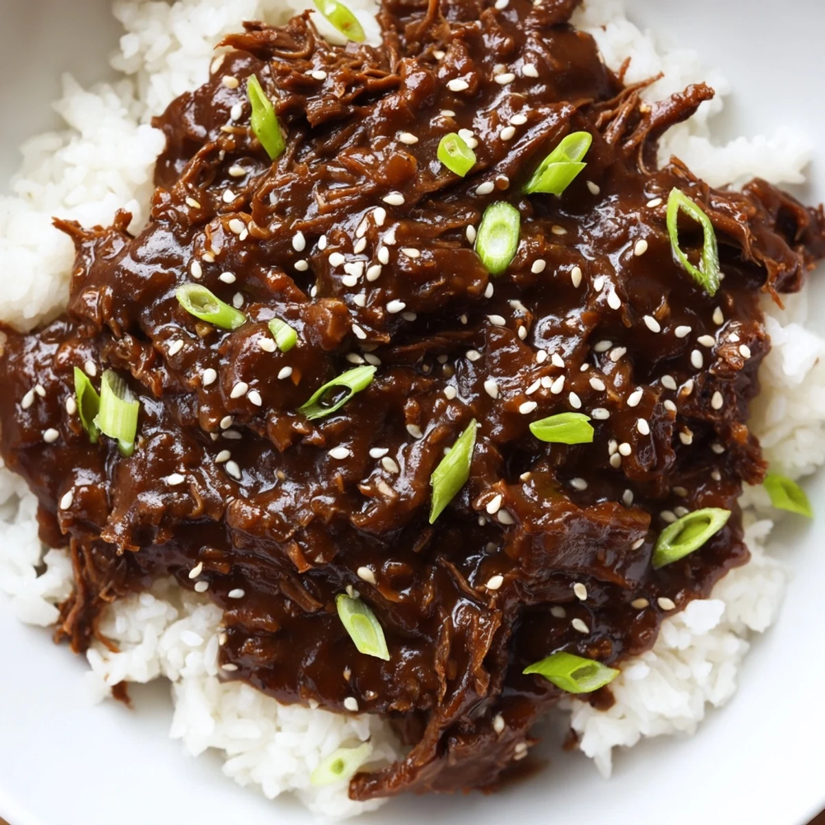 Slow-cooked Crock Pot Korean Beef with a forkful of meat, showcasing the tender texture and vibrant Korean-inspired flavors.