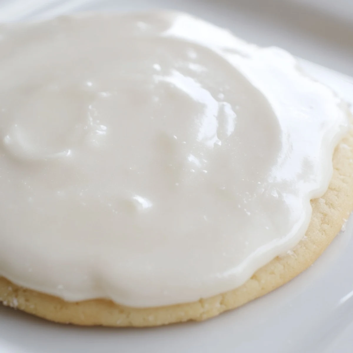 Brightly decorated cookies rest on a wire rack, showing off smooth Sugar Cookie Icing in vivid hues.