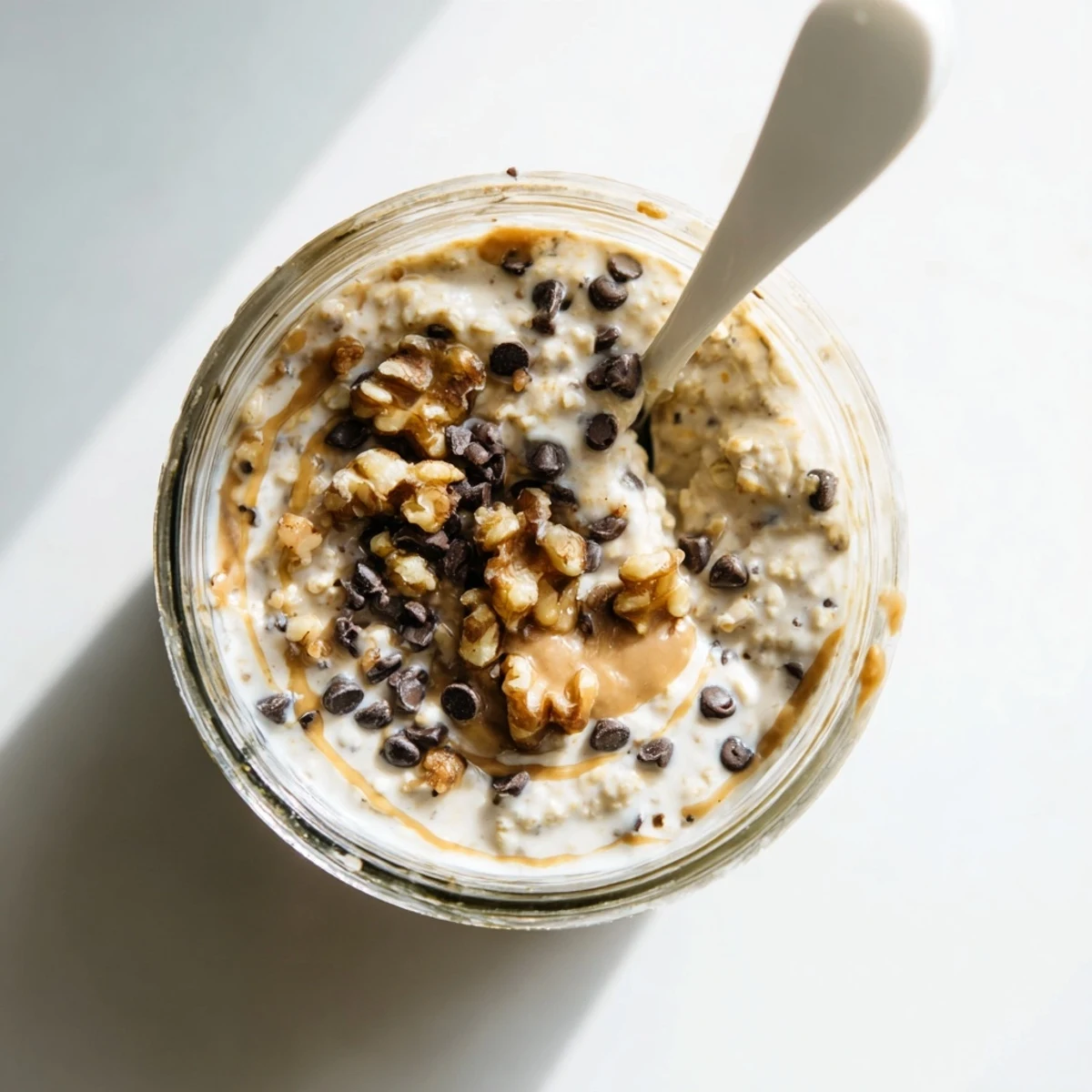 Creamy Cookie Dough Overnight Oats served with fresh berries and a maple drizzle.