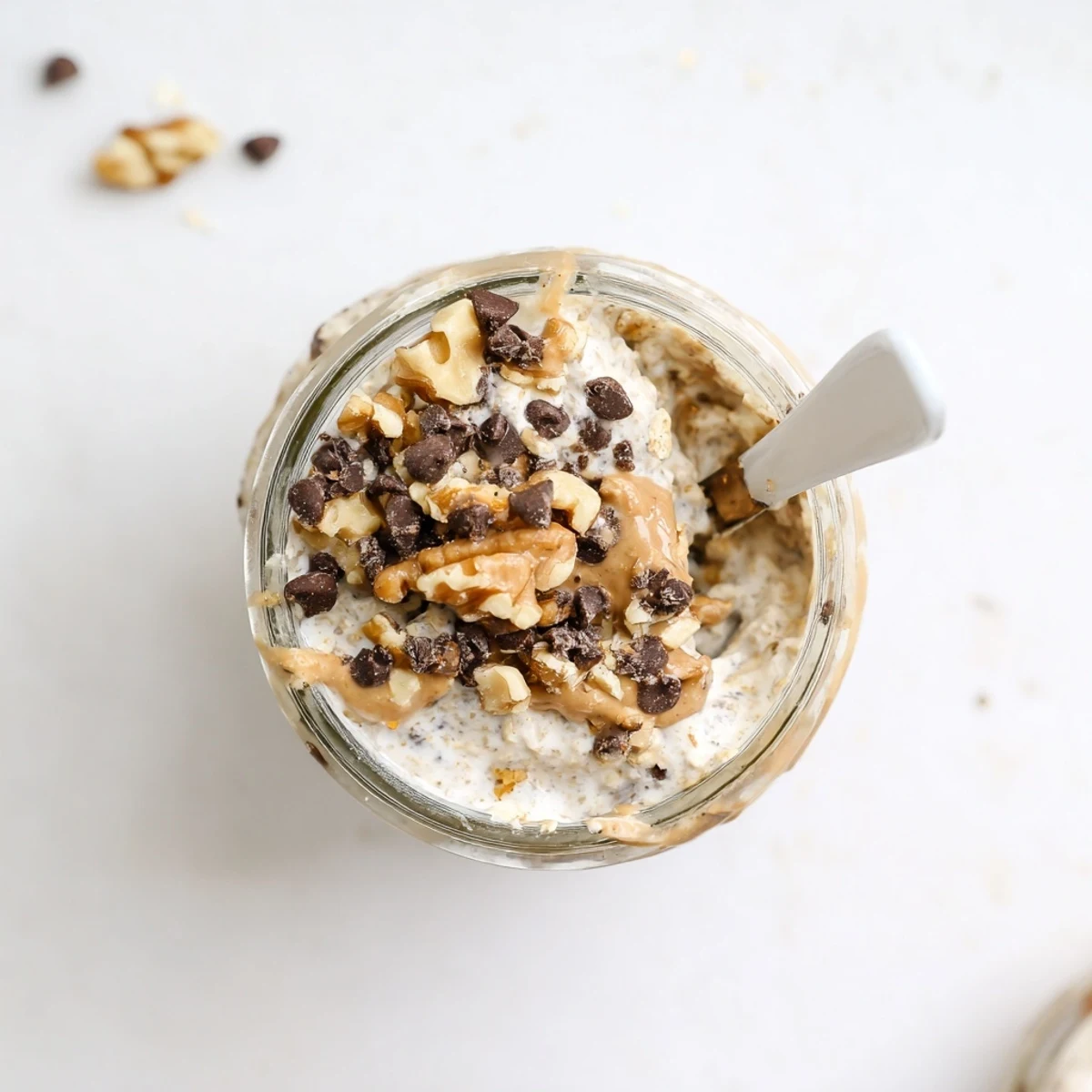 Rolled oats and Greek yogurt create a thick, chilled Cookie Dough Overnight Oats breakfast.