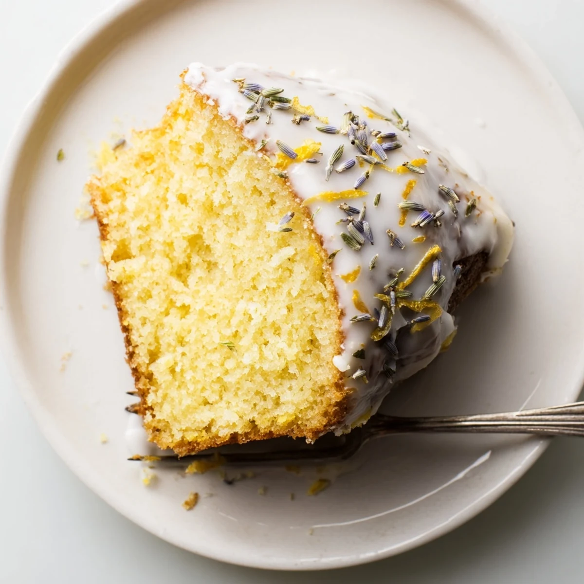 Elegant lemon lavender cake with zesty citrus glaze served for spring dessert