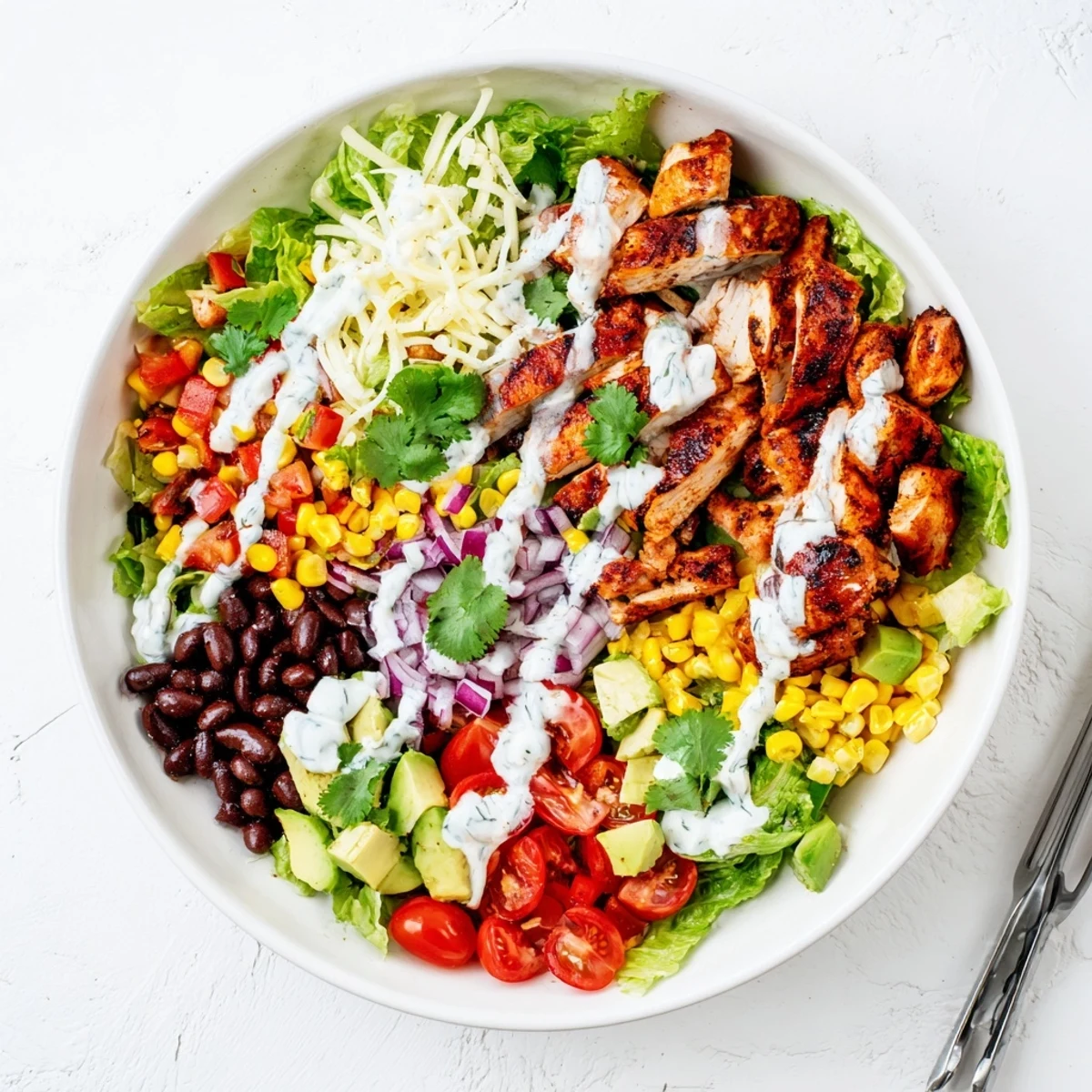 Protein-packed Healthy BBQ Chicken Chopped Salad featuring crisp romaine, avocado, and tangy BBQ dressing