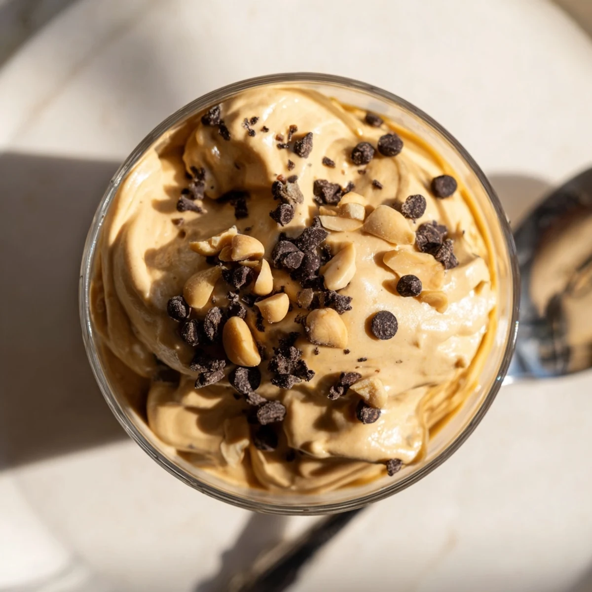 Light and fluffy peanut butter and Cool Whip mousse topped with crushed roasted peanuts