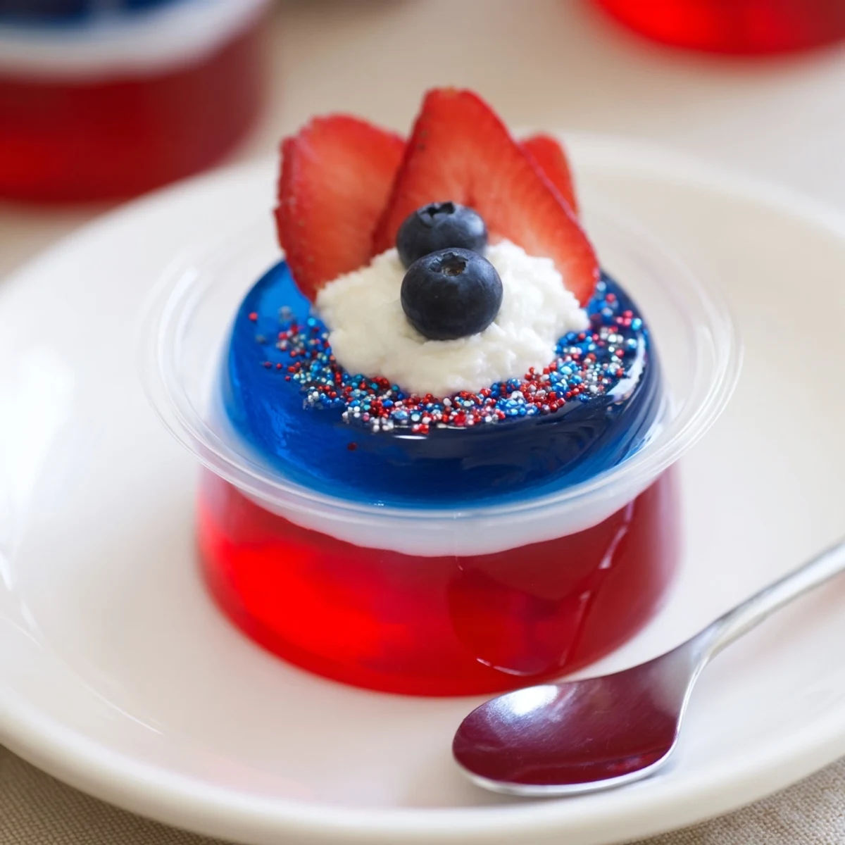 Mini Red White And Blue Jello Cups ready to serve with sprinkles