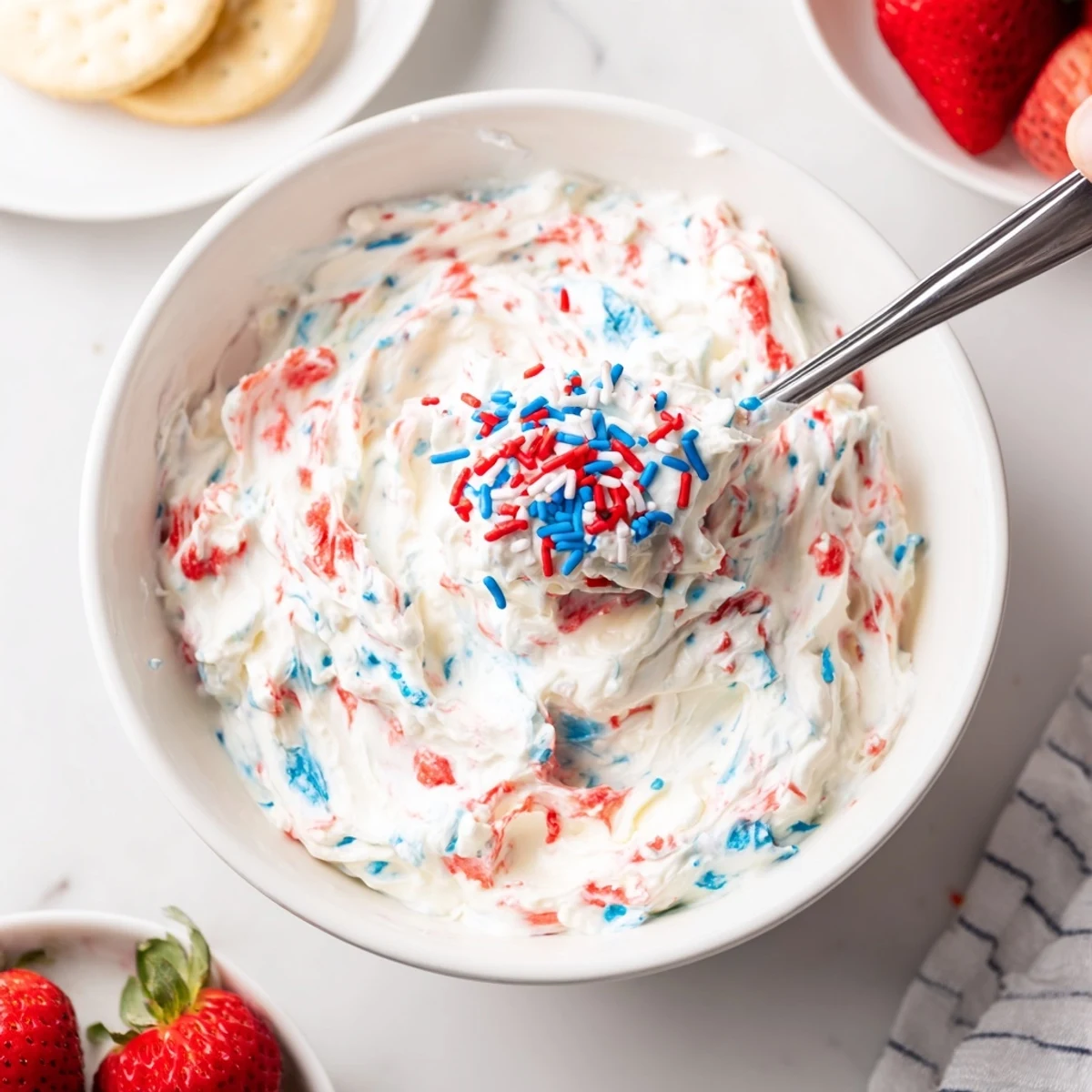 Hand whipped Red White And Blue Funfetti Dip, fluffy texture, pretzels for dipping