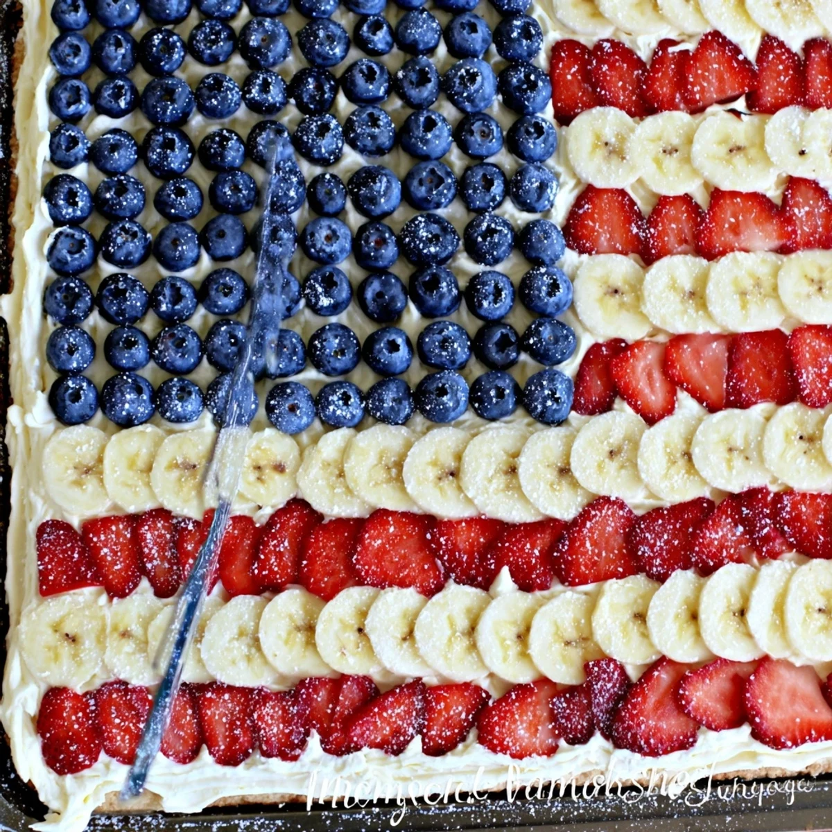 American Flag Fruit Pizza on a cookie crust, glossy berries, creamy frosting.
