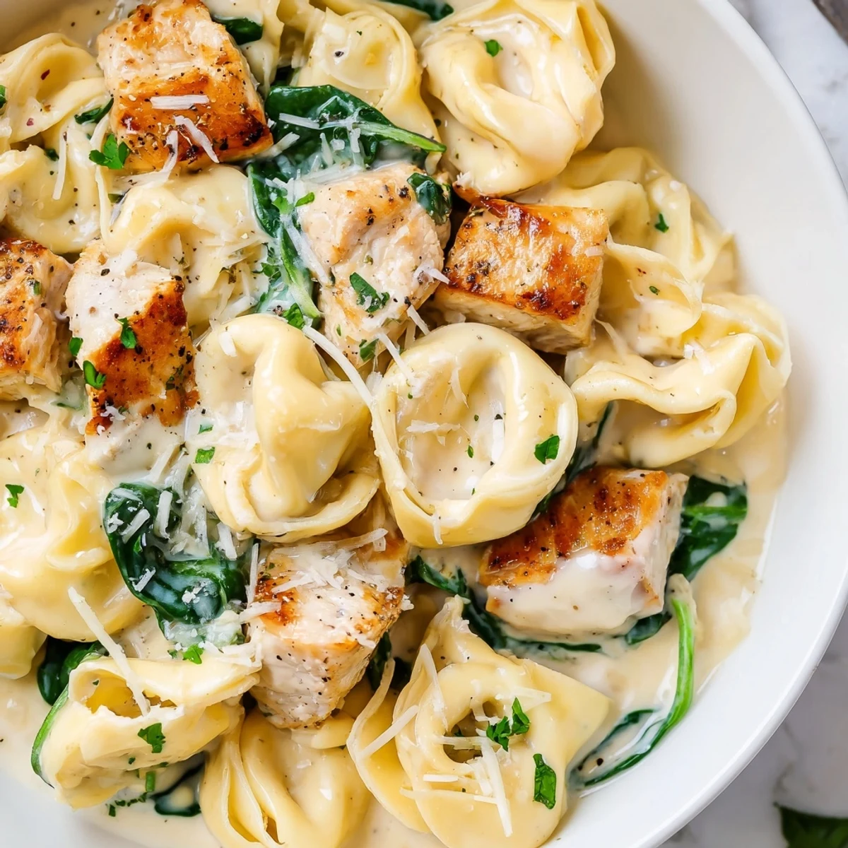 Creamy Garlic Chicken Tortellini with Spinach in a golden Parmesan sauce