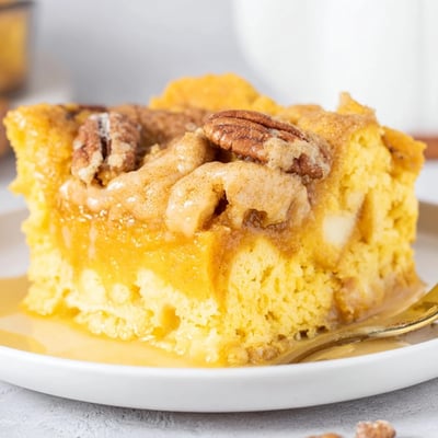 Warm Pumpkin Dump Cake cooling in pan, spicy aroma, ready with ice cream